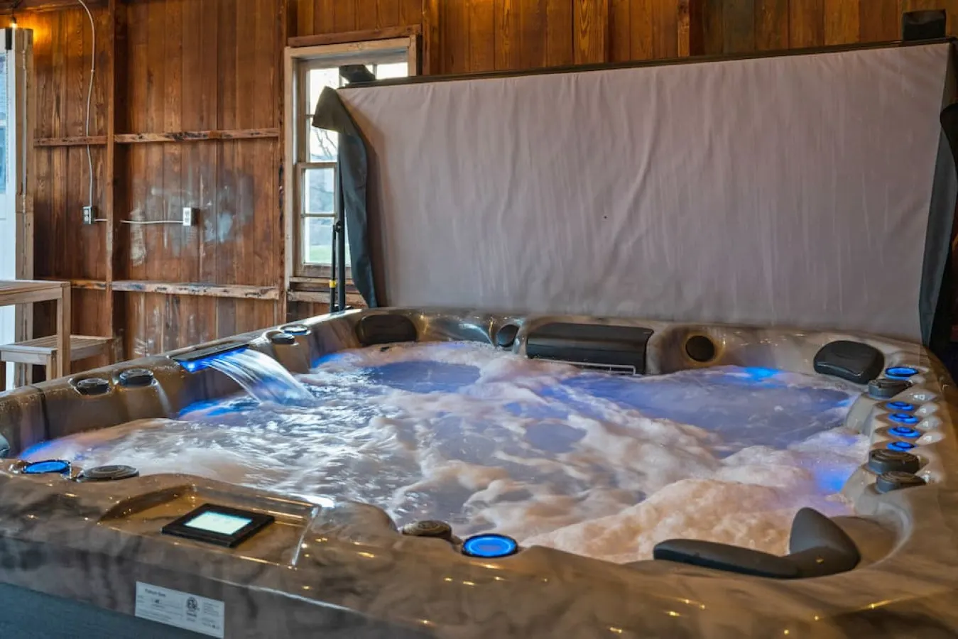 New! We just added a hot tub and outdoor kitchen to our carriage house.
