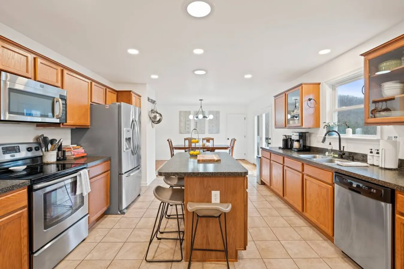 Create culinary masterpieces in our fully-equipped kitchen with spacious island for all your meal prep needs.