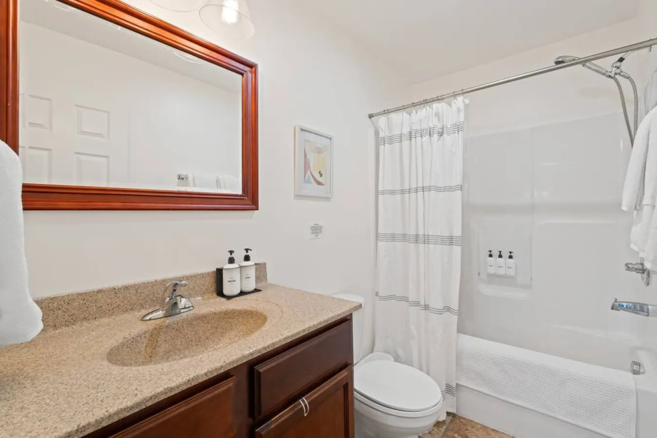 Unwind and recharge in our spacious full bathroom, complete with a luxurious tub shower combo for the ultimate relaxation.