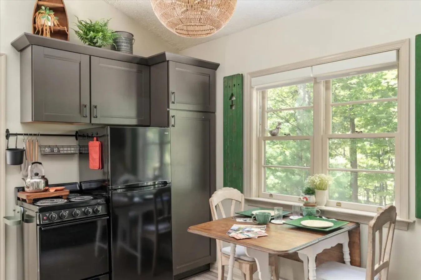 A water kettle on the stove whistles you back to the cozy vibes of this cabin. The mix of old and new decor make the place feel extra homey.