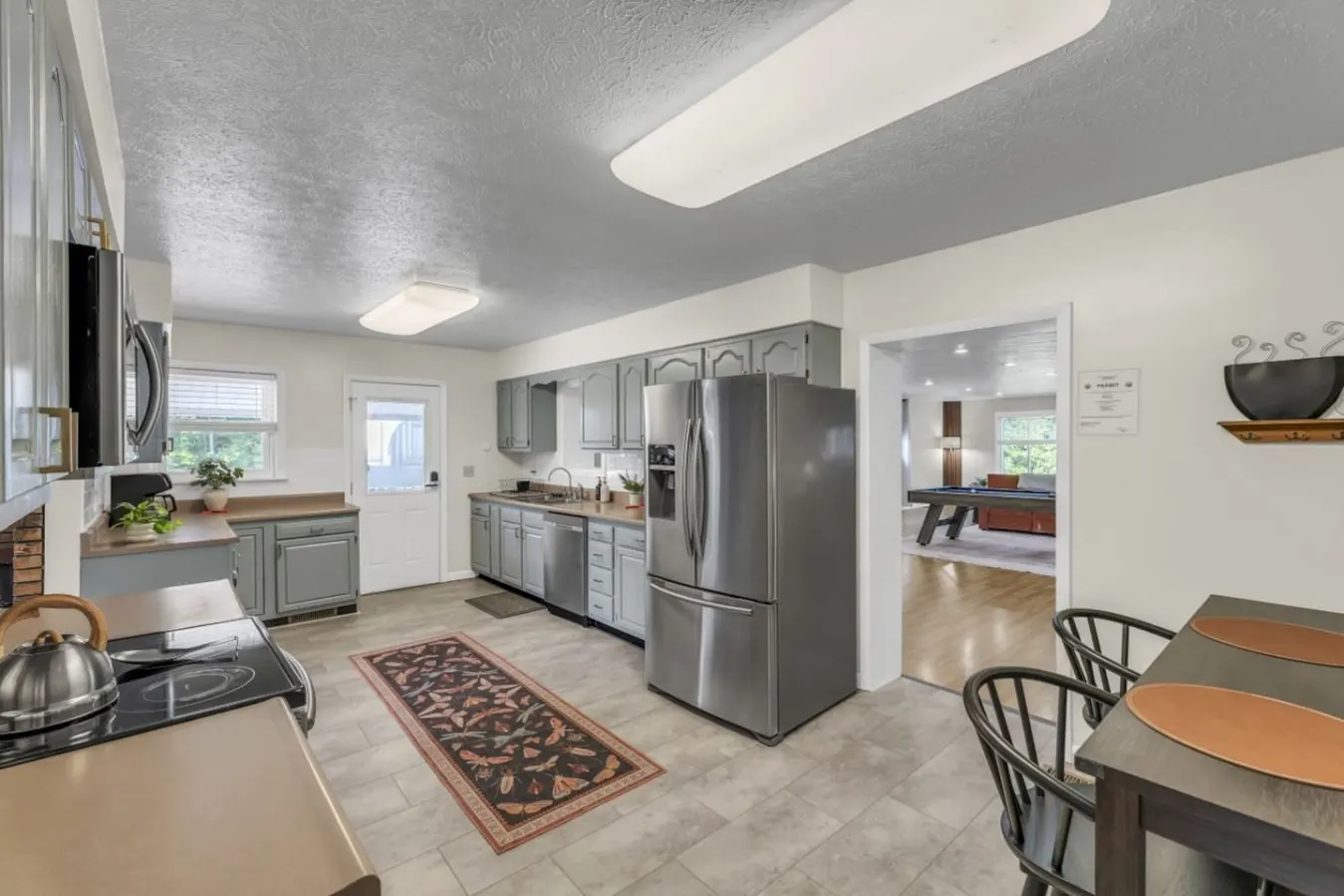 A roomy kitchen that opens straight to the game room.