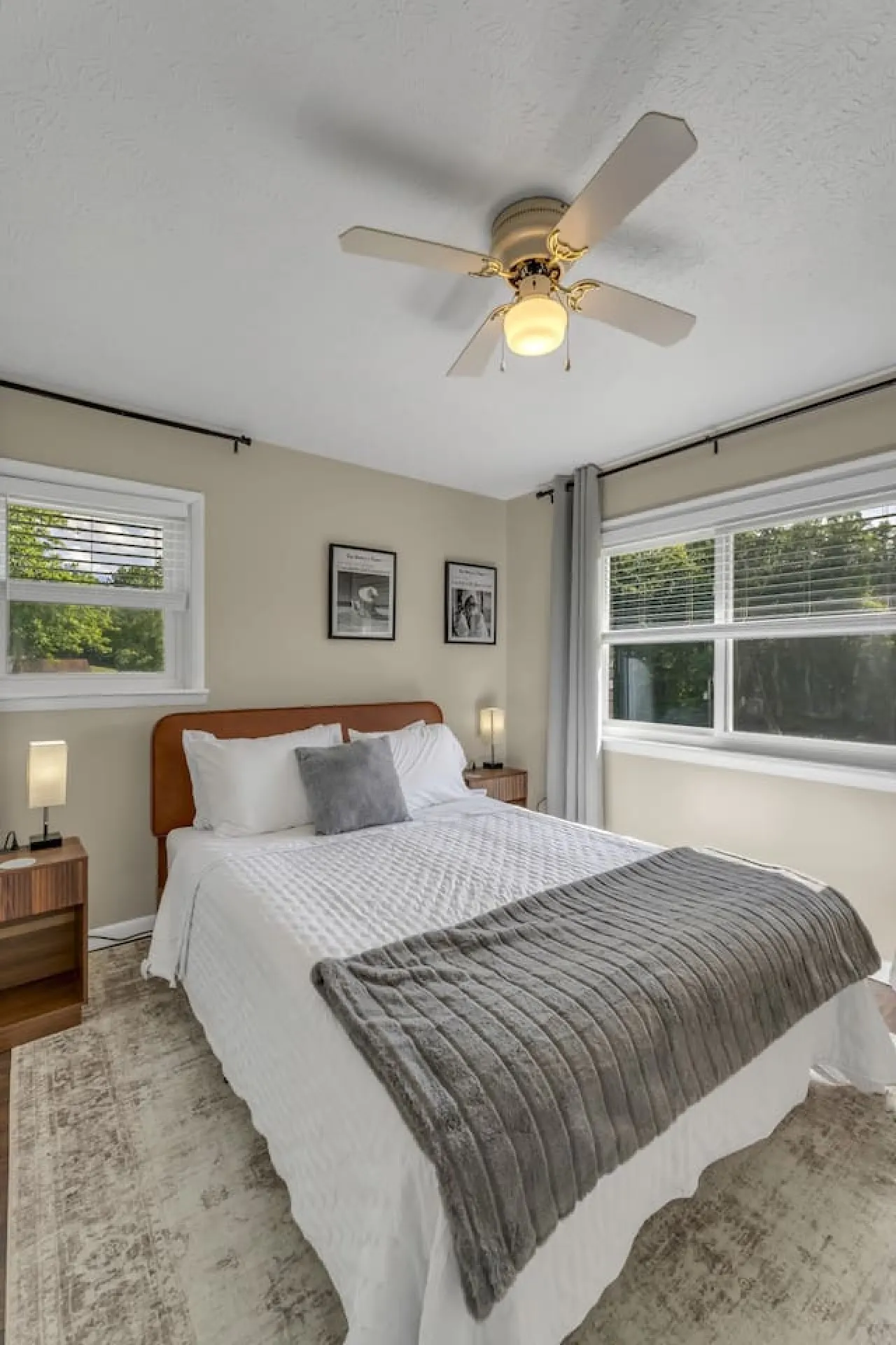 A bright queen room to settle into at the end of the day.