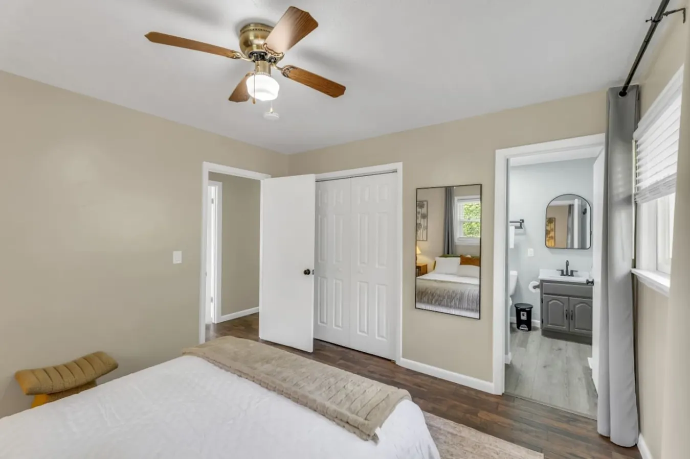 A restful room with its own vanity tucked in the corner.